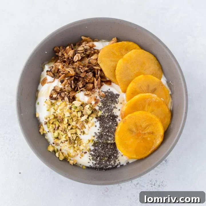 Beautifully plated Roasted Persimmons with Greek Yogurt and Pistachios, ready for serving.