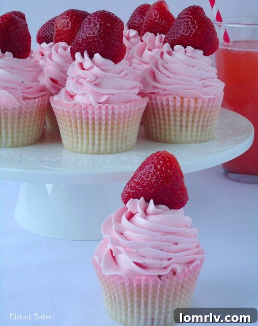 Vibrant Strawberry Lemonade Cupcakes with pink frosting