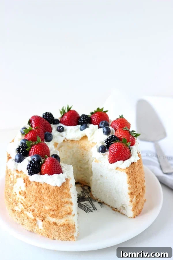 Honey Coconut Angel Food Cake – A beautiful and delicious showstopper cake with honey and coconut, perfect for spring holidays.