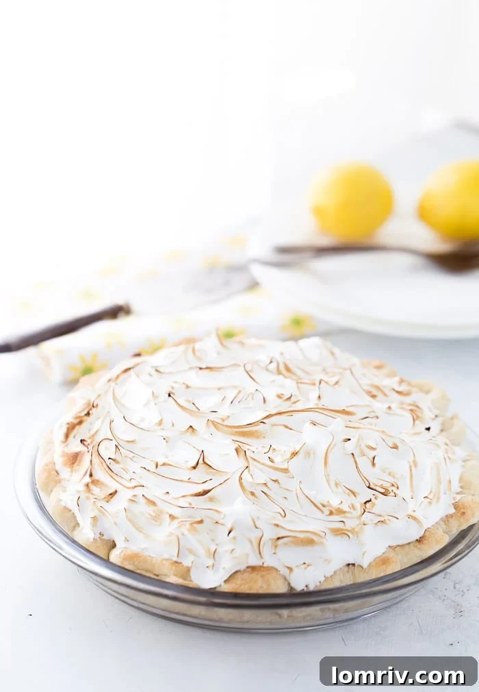 This classic lemon meringue pie is beyond amazing with a flaky pie crust filled with tart lemon custard filling and topped with a toasty meringue cloud.