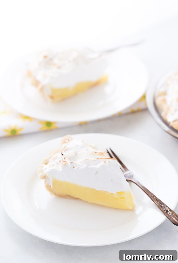 This classic lemon meringue pie is beyond amazing with a flaky pie crust filled with tart lemon custard filling and topped with a toasty meringue cloud.