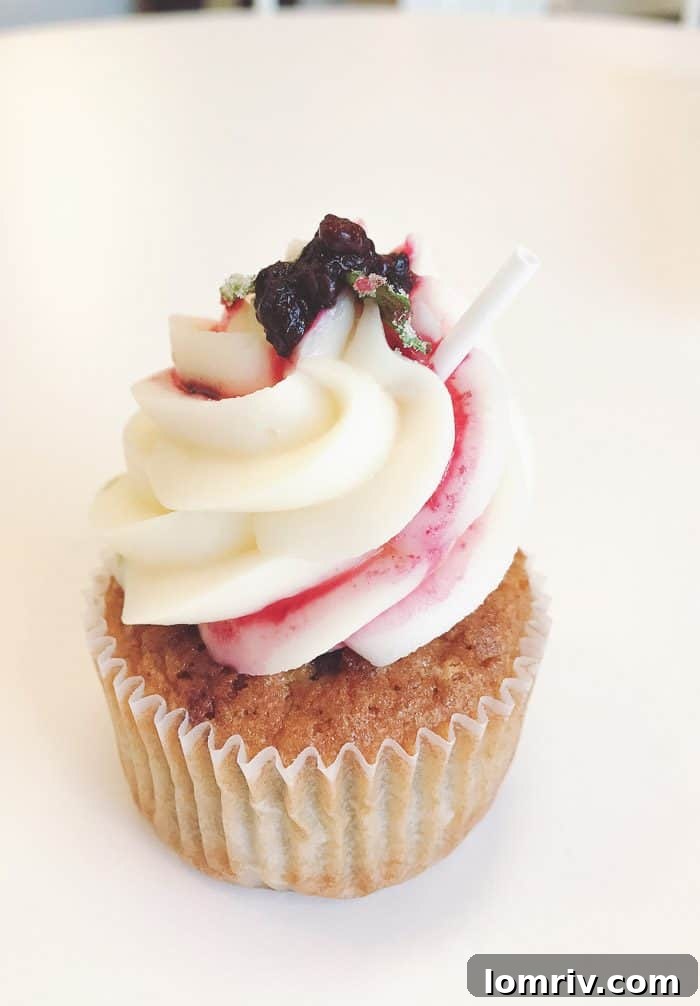 An inviting display of uniquely flavored cupcakes from Cupcake Downsouth, including the refreshing Blackberry Mojito.