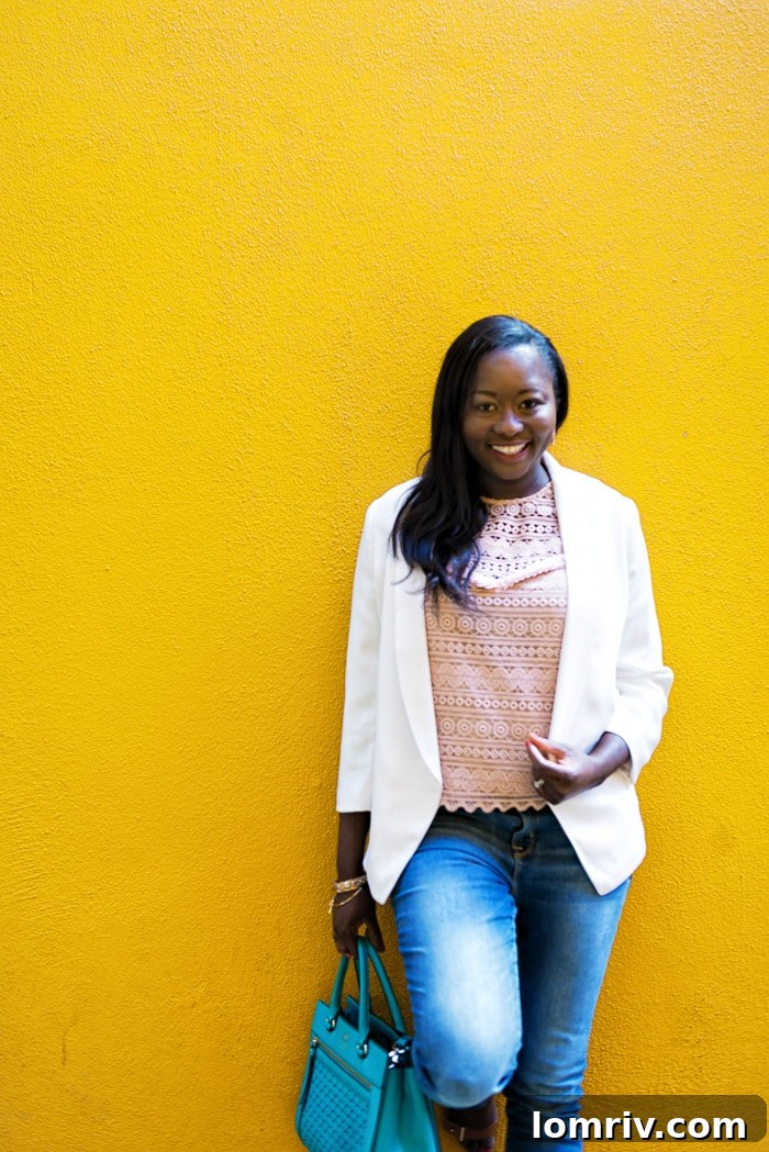 A versatile white blazer completes a sophisticated casual ensemble, ideal for various occasions.