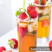 This classic Pimm's cup recipe is refreshing with a splash of orange blossom water and filled with fresh strawberries and sliced cucumber.