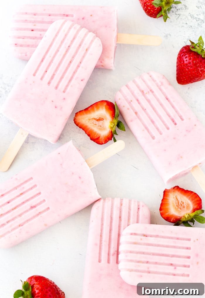Cool down with homemade Strawberry Coconut Cheesecake Popsicles - easy recipe for a refreshing summer treat.