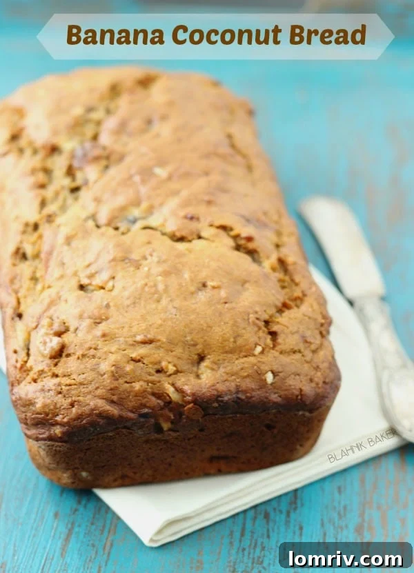 Delicious loaf of Banana Coconut Bread, golden brown with a hint of coconut flakes