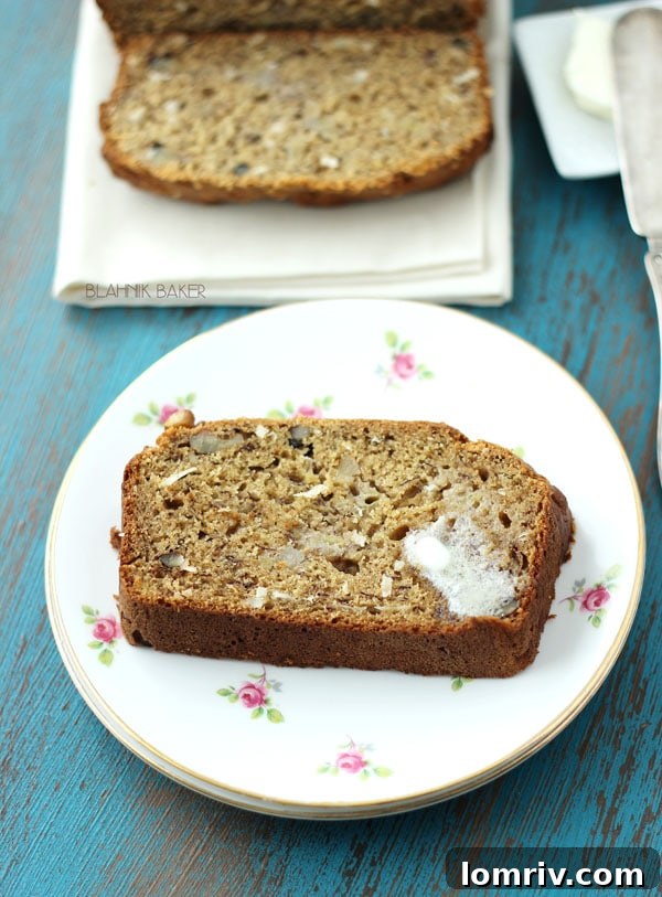 Sliced Banana Coconut Bread on a cooling rack, showcasing its moist interior