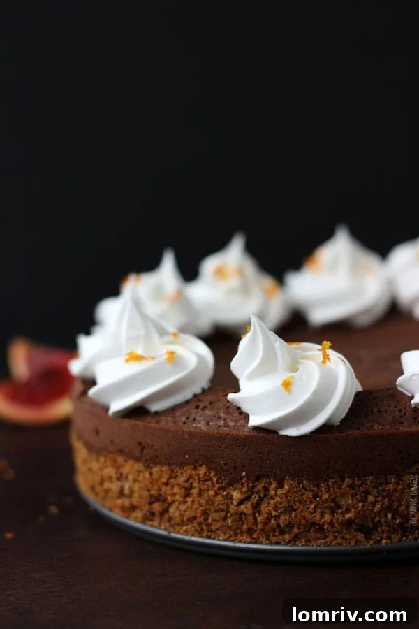 Decadent Blood Orange Chocolate Truffle Torte on a serving platter, showcasing its rich texture and beautiful citrus garnish.