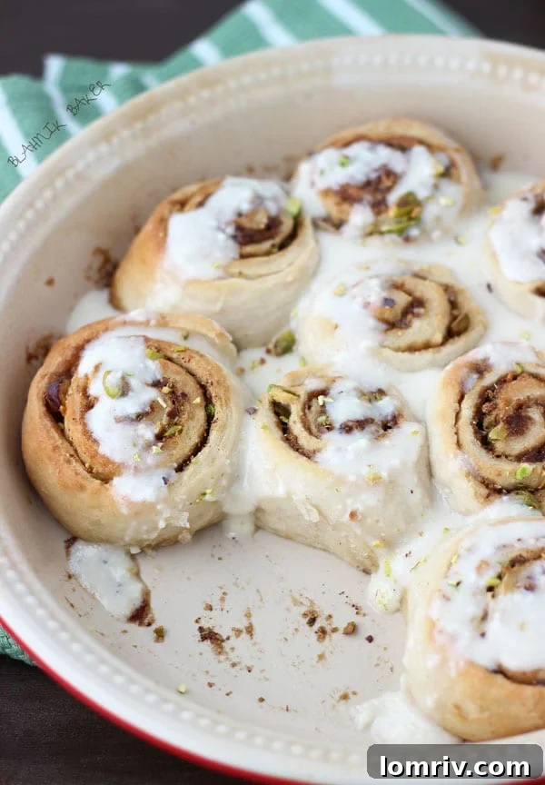 Close-up of Guinness Pistachio Sweet Rolls with Cream Cheese Glaze