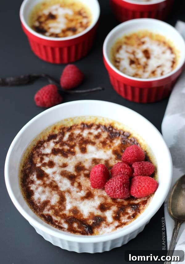 Close-up of the caramelized sugar crust on Vanilla Bean Crème Brûlée, showing its crackled perfection