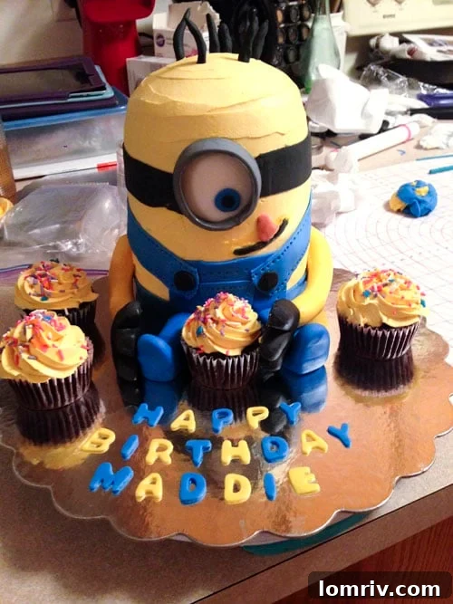 A colorful and creatively decorated Minion birthday cake, handmade for a special celebration.