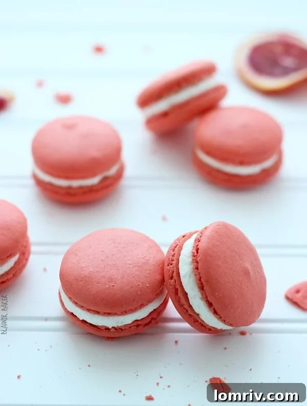 Delicious Blood Orange Walnut Macarons arranged beautifully on a plate.