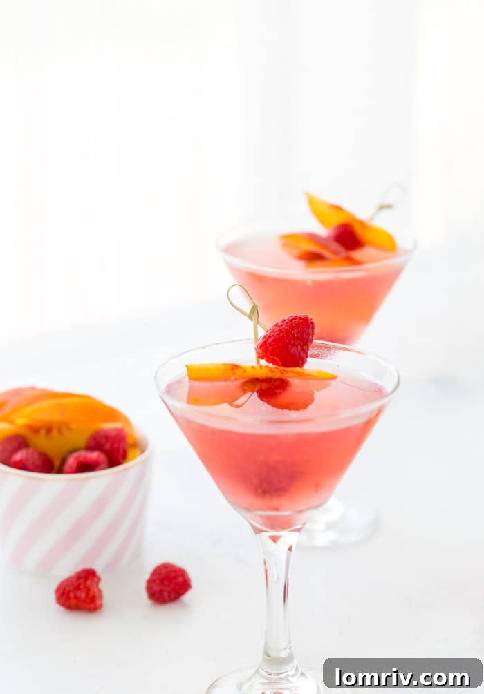 This summer peach raspberry martini recipe is filled with fresh raspberries and juicy peach flavors. A refreshing summer cocktail that's easy to whip up. 