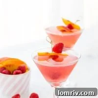 This summer peach raspberry martini recipe is filled with fresh raspberries and juicy peach flavors. A refreshing summer cocktail that's easy to whip up.