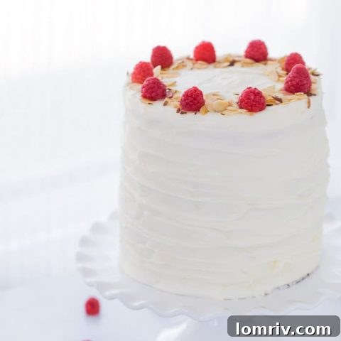 A luscious lemon raspberry cake recipe that is filled with a whipped honey mascarpone filling, raspberry compote and sweet cream cheese frosting.