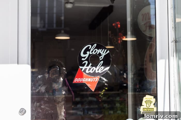 A vibrant selection of artisan doughnuts from Glory Hole Doughnuts, showcasing unique flavors and toppings, a highlight of Toronto's sweet scene.