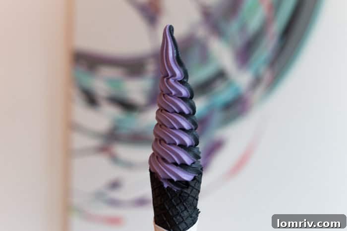 The 'Krusty the Cone' ice cream creation from Sweet Jesus, featuring soft serve, cotton candy, and sprinkles, an iconic Toronto dessert.