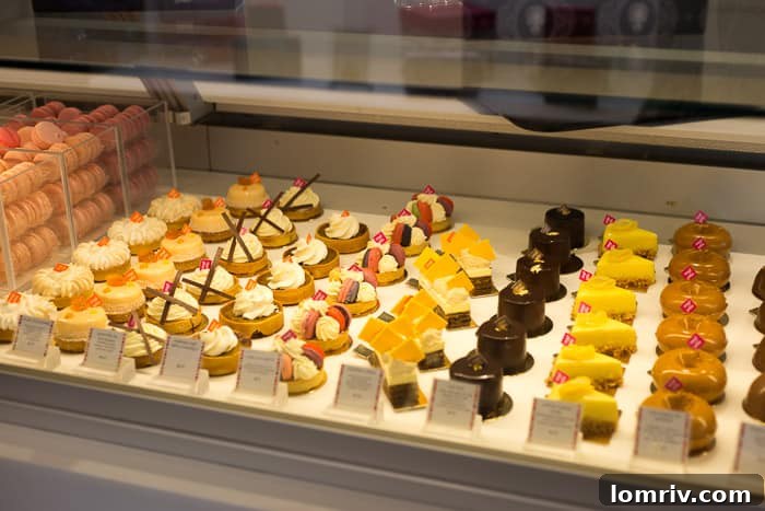 A tantalizing spread of various pastries, tarts, and cakes from Nadege Patisserie, demonstrating the broad selection of high-quality French desserts available in Toronto.