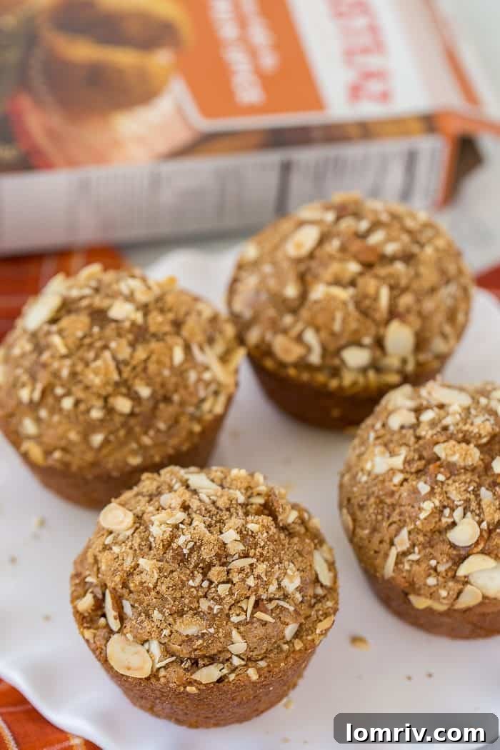 Moist, hearty pumpkin spice carrot muffins packed with carrots and walnuts, ideal for a cozy fall breakfast or an afternoon pick-me-up. Enjoy with a cup of coffee.