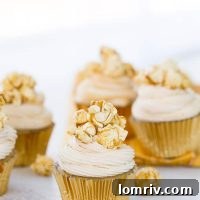 Caramel Corn Cupcakes topped with caramel drizzle and popcorn