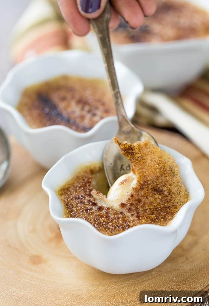 A close-up of a single Honey Caramel Creme Brulee ramekin, showing the perfect golden-brown caramelized sugar topping