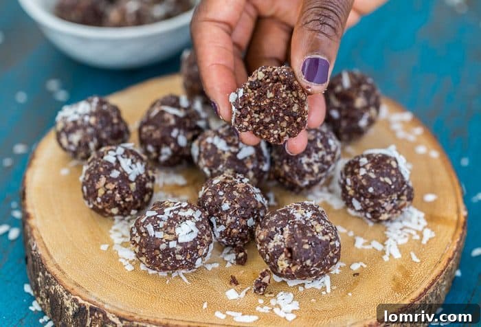 Freshly blended ingredients for the brownie energy bites, showing a rich, fudgy dough-like consistency before being rolled into balls, emphasizing the simplicity of the process.