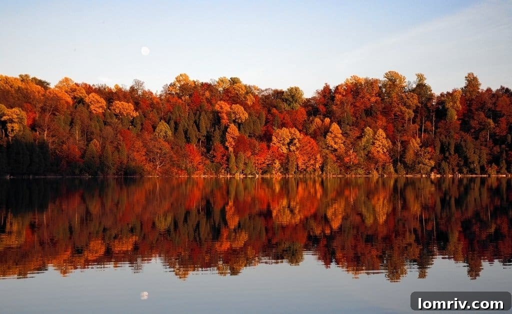 Vibrant fall foliage surrounding the stunning emerald waters of Green Lakes State Park
