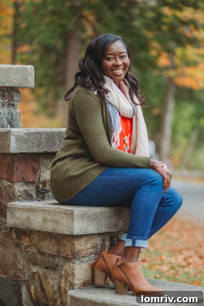 Side profile of a woman wearing a cozy green fall sweater, highlighting the soft knit and comfortable fit, perfect for autumn fashion.