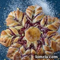 This Cranberry Cinnamon Star Bread is a holiday spectacular with a warm cranberry, brie and pistachio filling wrapped around a fluffy bread.