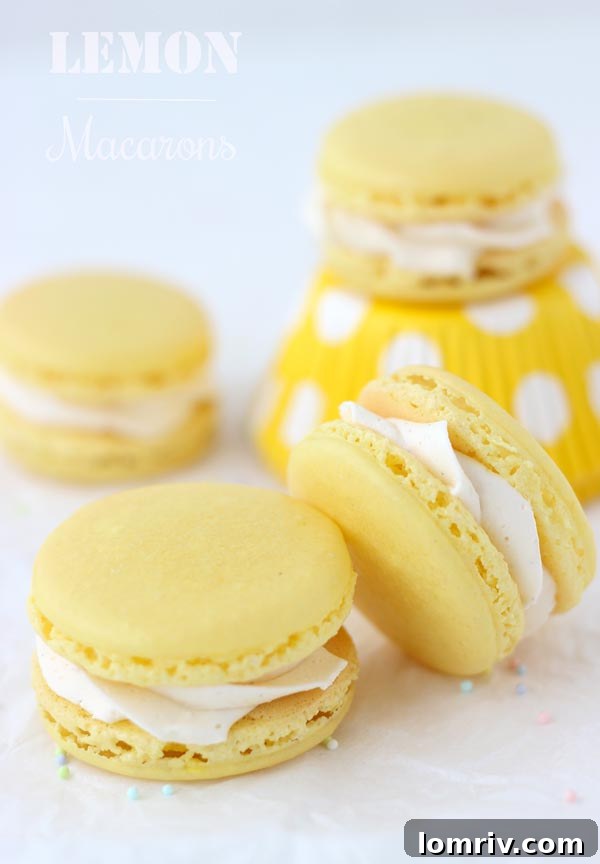 A stack of golden Lemon Macarons on a white plate