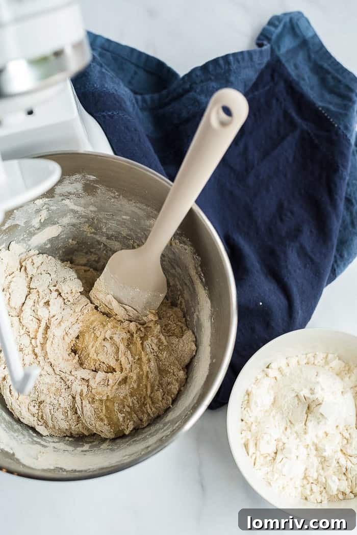 A pristine view of the Honey Whole Wheat Bread dough after its first rise, showcasing its fluffy and airy texture.