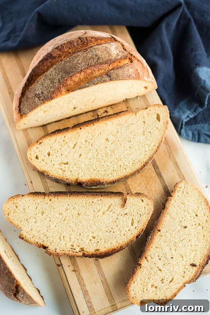 A close-up view of a slice of Honey Whole Wheat Bread, revealing its soft and airy crumb texture.