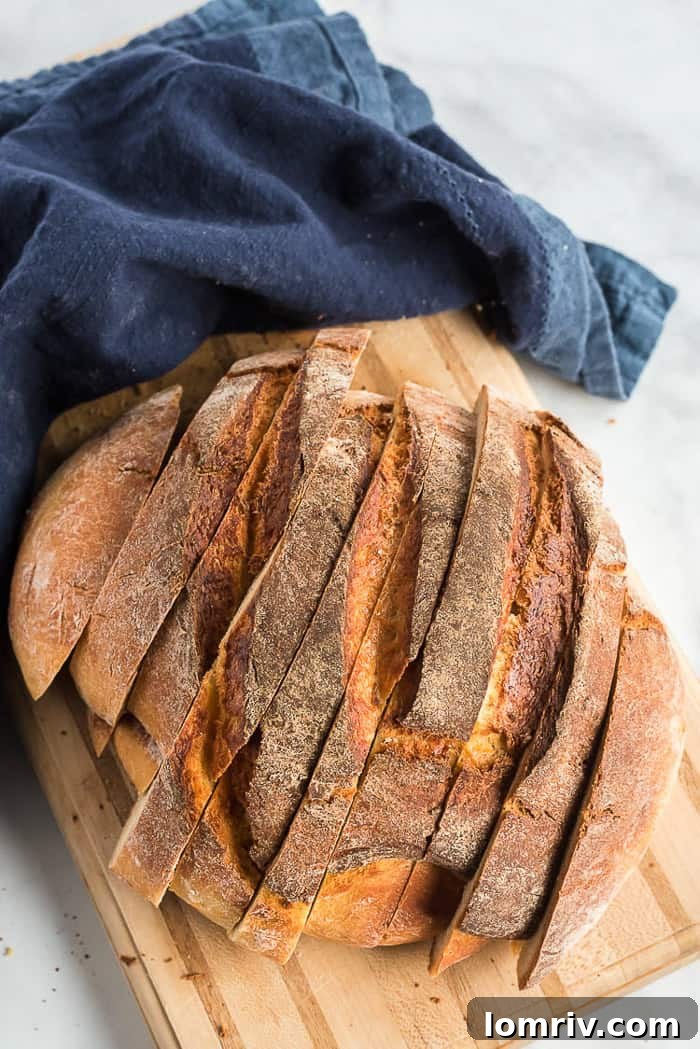 A freshly baked Honey Whole Wheat Bread loaf resting on a cooling rack, steam gently rising, promising a delightful taste.