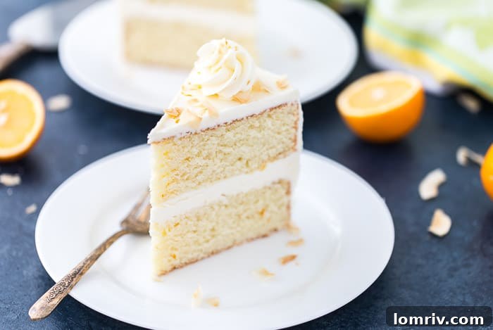 Close-up of a slice of Meyer Lemon Coconut Cake, showing moist texture