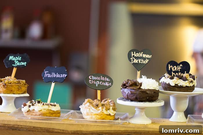 A close-up view of freshly prepared doughnuts featuring unique and colorful toppings, demonstrating the artistry at Just Donuts in Syracuse.