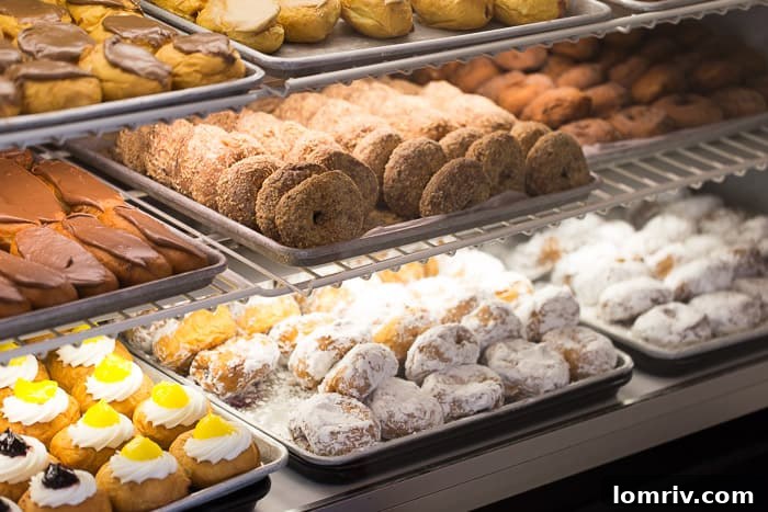 A close-up view of a perfectly golden and glazed traditional doughnut, highlighting the artisanal quality at Harrison Bakery.