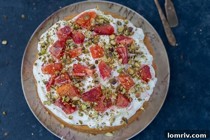 Close-up of Moist Orange Chiffon Cake with Green Pistachio Swirls