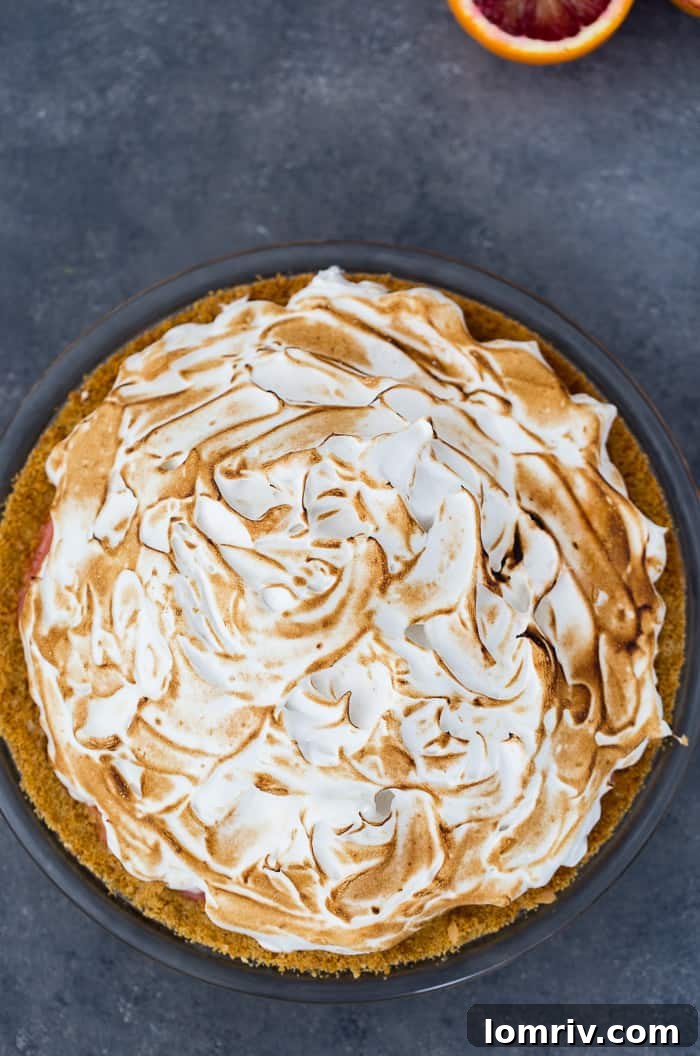 Vibrant Blood Orange Meringue Pie, a perfect winter dessert.