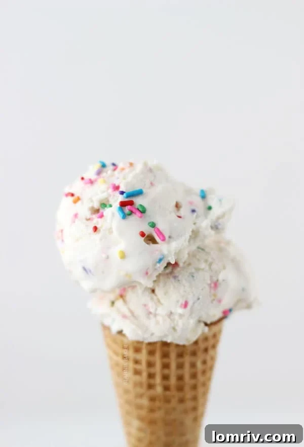 Delicious Funfetti Golden Oreo Ice Cream in a bowl, garnished with Golden Oreos and sprinkles