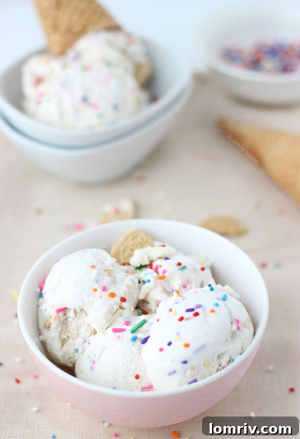 Three scoops of homemade Funfetti Golden Oreo Ice Cream in a bowl, close up to show texture