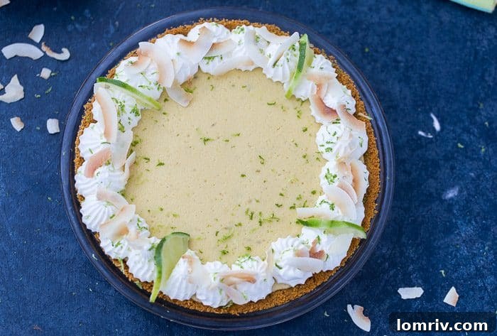Sliced Coconut Key Lime Pie, showcasing the creamy filling and coconut crust.