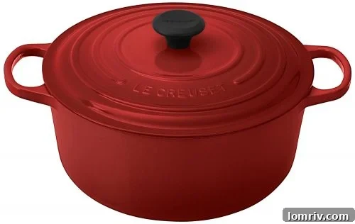 A classic enameled cast-iron Dutch oven simmering on a stovetop, exuding warmth and the promise of a delicious slow-cooked meal.