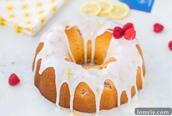 Close-up of Raspberry Lemonade Pound Cake with fresh raspberries
