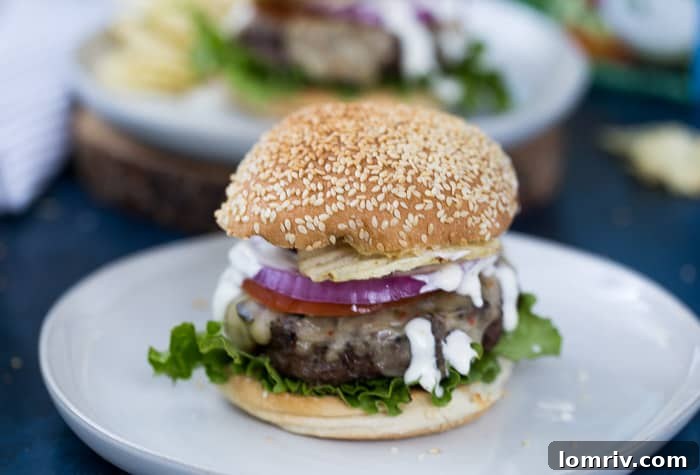 A Ranch Burger cut in half, revealing its juicy interior and toppings