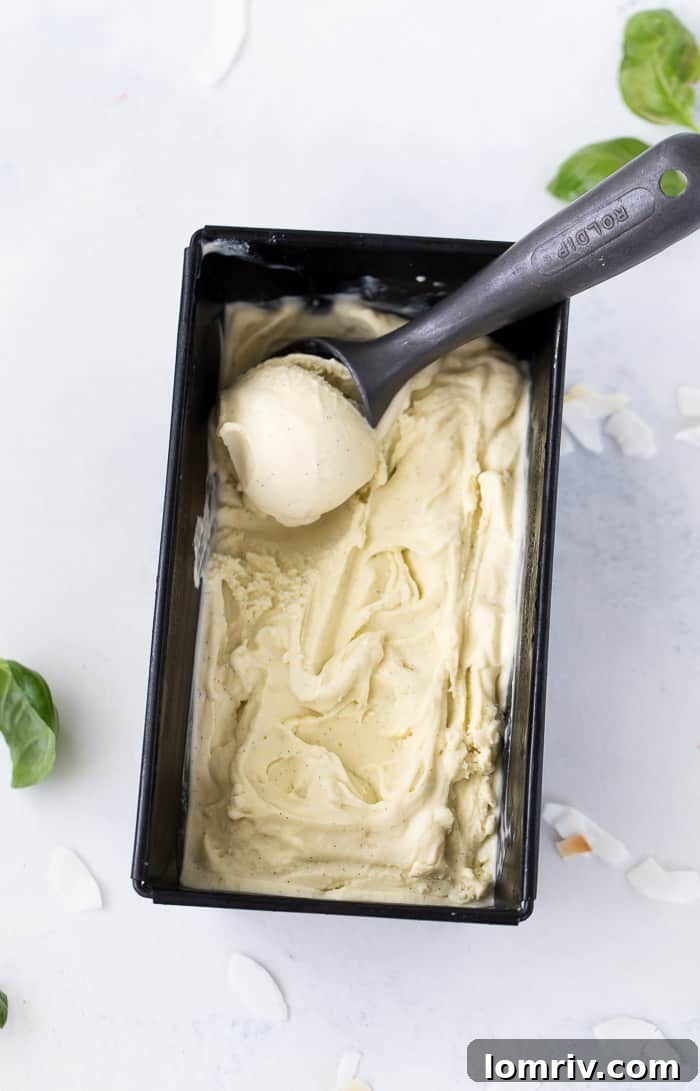 Fresh basil leaves infusing in milk mixture for ice cream