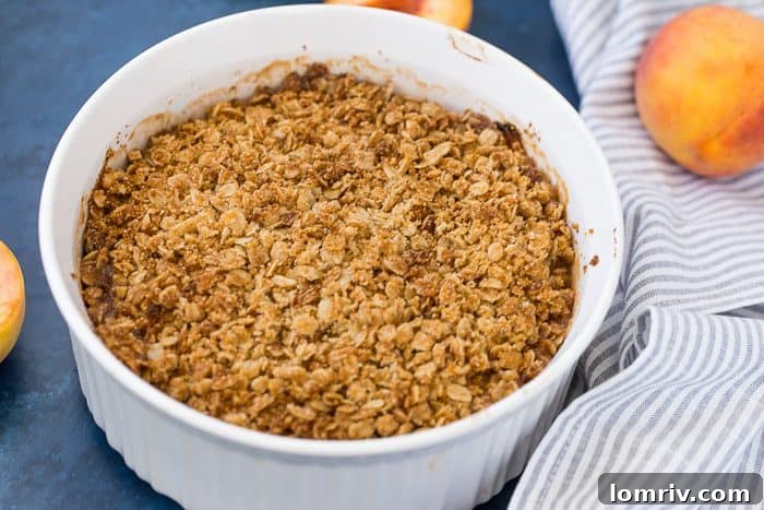 Baked peach crumble, golden and bubbling