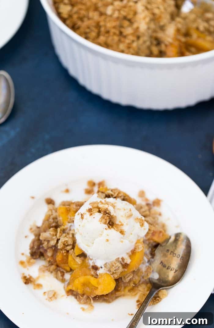 Peach crumble served with vanilla ice cream