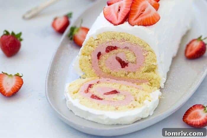 Close-up of a strawberry roll cake slice showing layers