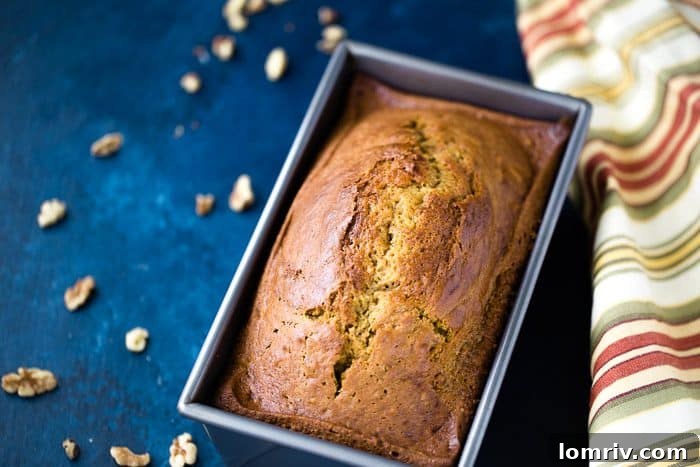 Warm Classic Pumpkin Bread with a steaming cup of coffee
