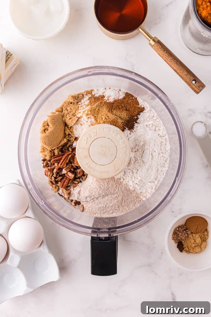 Pumpkin tart ingredients in a food processor